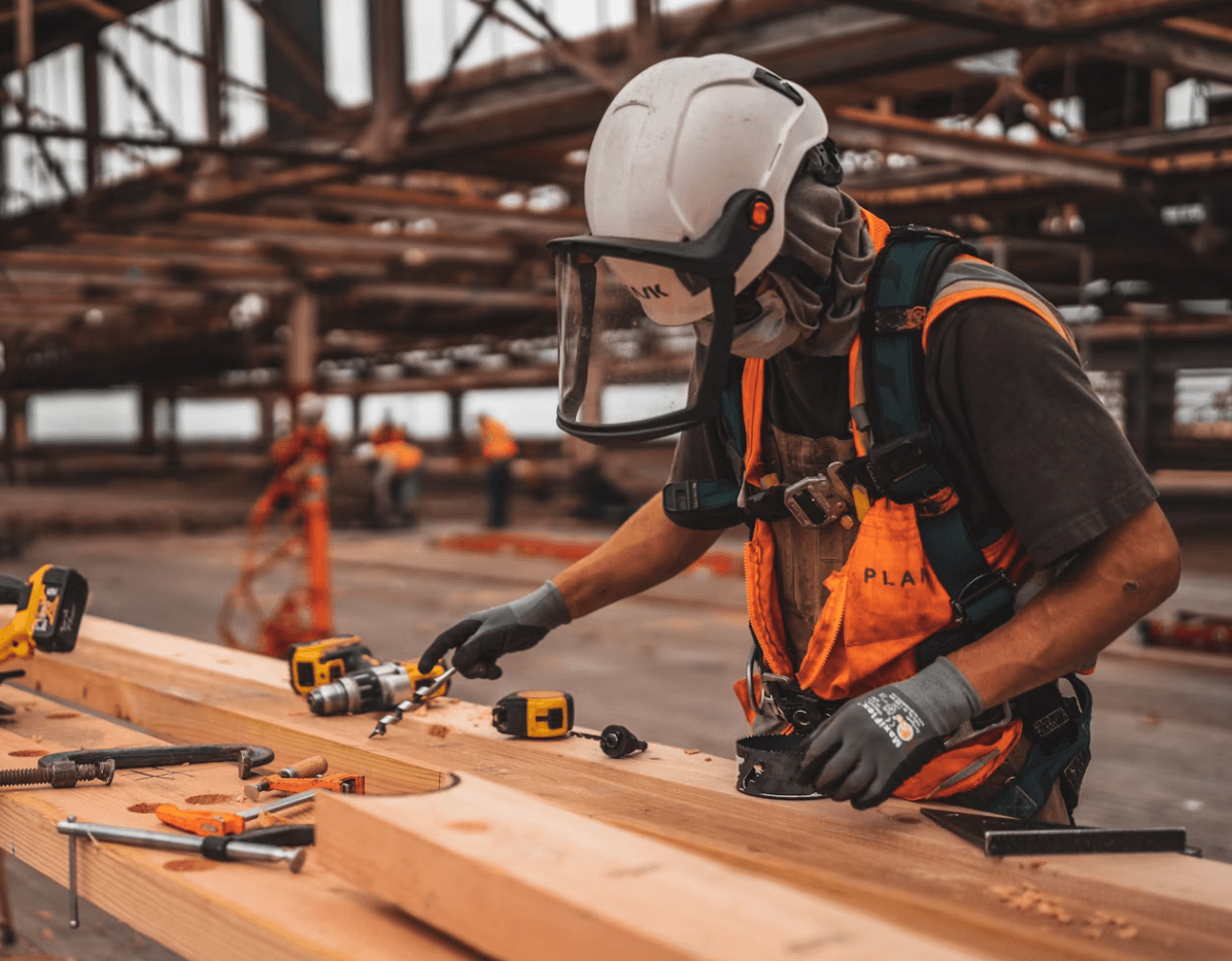 A construction worker in hi-vis working on site